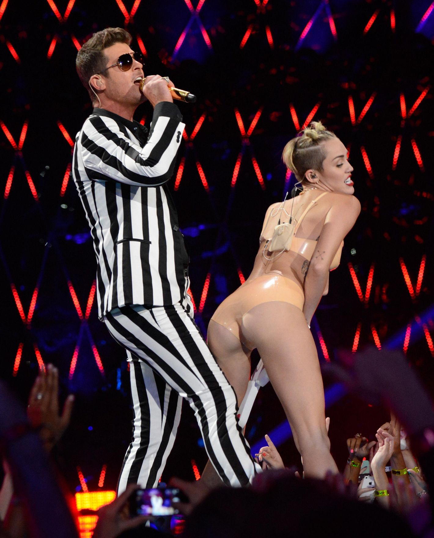 brandon setto add miley cyrus nude on stage photo